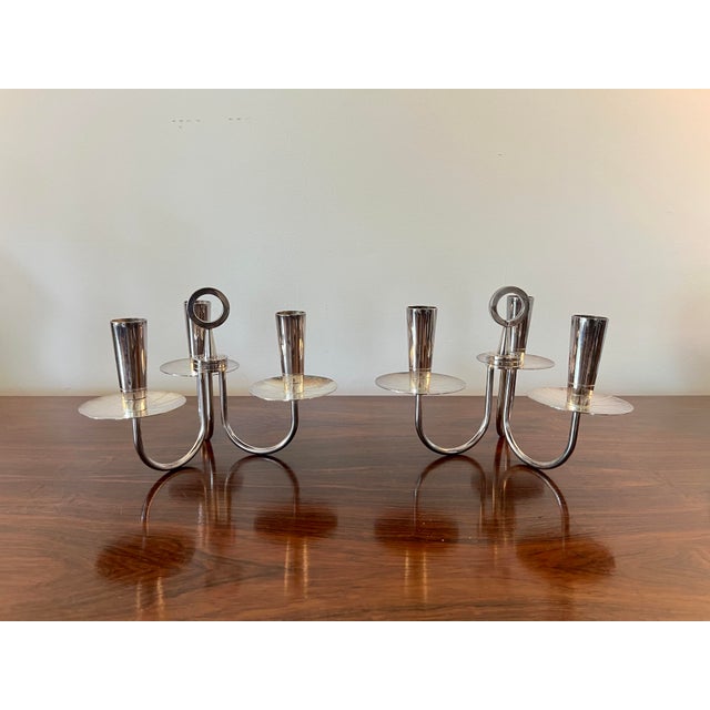 Amazing pair of candleholders attributed to Tommi Parzinger. I believe they’re silver plate, some areas with slight but...
