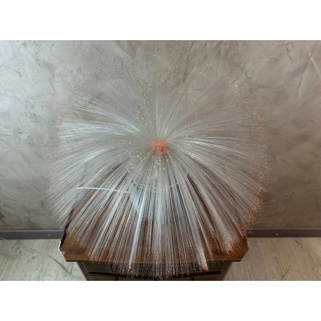 Superb "La spherique" lamp dating from the 60s in chrome metal and fiberglass hair forming a sphere once in place. The end...