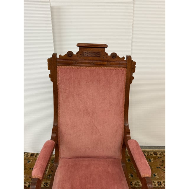 Design Plus Gallery presents a Platform Rocking Chair with Victorian Era Style + Age. The chair has a blush rose pink...