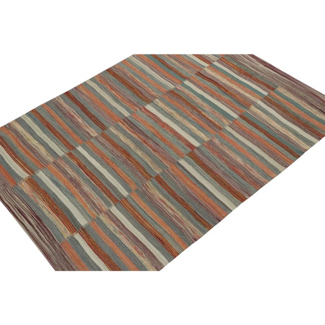 This vintage 6x8 Persian kilim is handwoven in wool, and originates circa 1950-1960. On the Design: This design remarks...