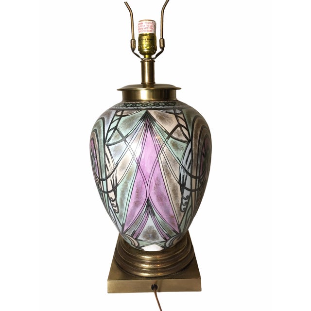 Lovely ceramic table lamp by Frederick Cooper. This hand painted piece in tones of peach, pink, blue and green, features a...