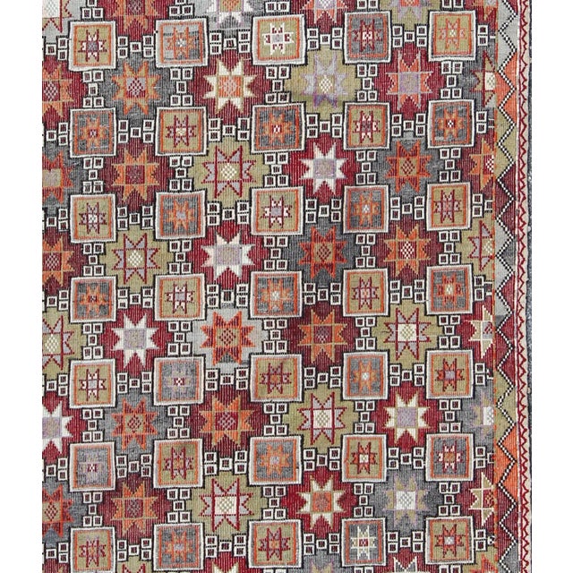 Keivan Woven Arts, Tu-Ned-012787, Featuring tribal shapes of stars and boxes with a spotted and speckled assortment of...
