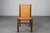 Set of twelve dining chairs with wooden frame, seat and back in leather designed by Ilmari Tapiovaara and produced by La...