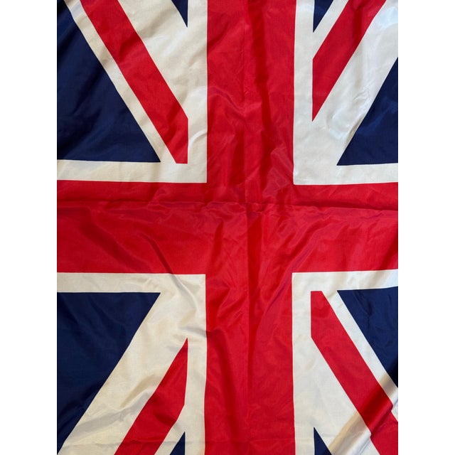 This is a late 20th century Union Jack flag. It is made from nylon. It features a classic combination of the crosses of...
