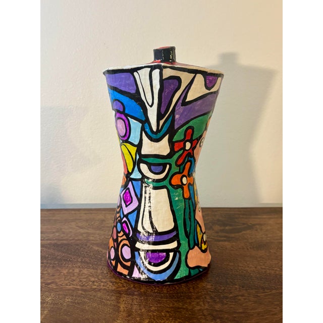 A vibrant handcrafted Cuban folk art paper mache espresso pot, hand painted in an expressive palette of bold colors and...