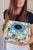 Authentic vintage Pucci circa early 2000s In excellent vintage condition Printed canvas Blue leather accents Pull open...