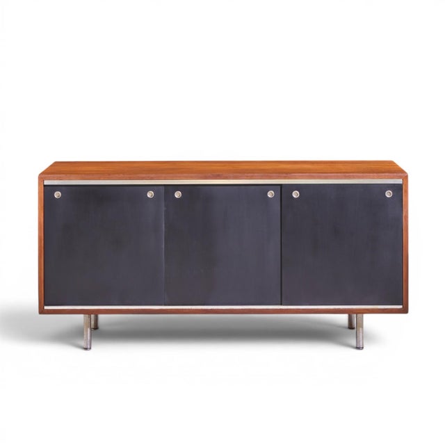 George Nelson for Herman Miller 8000 Series Mid Century Walnut Sliding Door Credenza This credenza measures: 52.75 wide x...