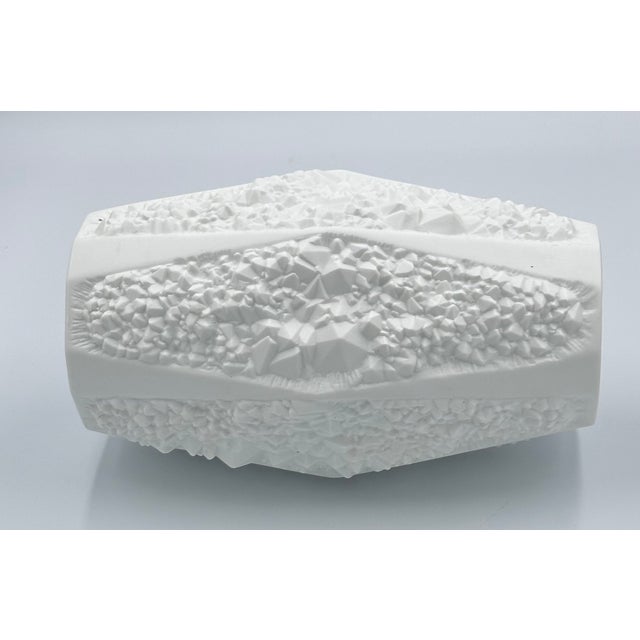 Discover a true treasure with this exquisite vintage 1960s AK Kaiser Bisque Porcelain Vase, meticulously crafted in...