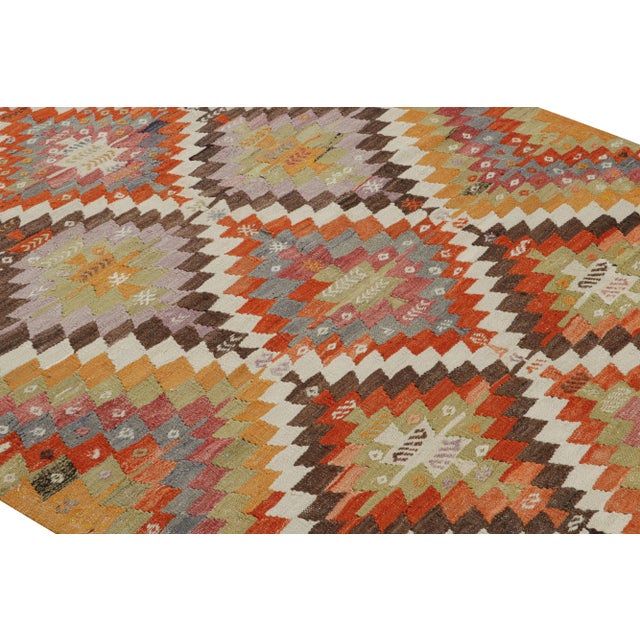 Flat-Woven In Turkey Originating Between 1950-1960, This Vintage Midcentury Tribal Kilim Hails From The City Of Denizli,...