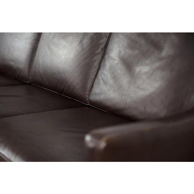 This three-seater sofa was made in Denmark during the 1960s. The sofa is completely upholstered in natural leather in a...