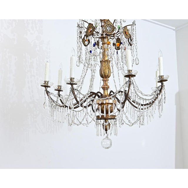 A spectacular and massive 18th century Genovese-style Italian chandelier decorated with transparent and jewel-tone...