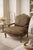 Add a touch of dramatic flair to your space with this substantial French Provincial Bergere armchair. The classic, hand-...