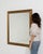 A mirror whose gold gilt frame with dark wood outer edge gives it real character at first glance. It was made in France...