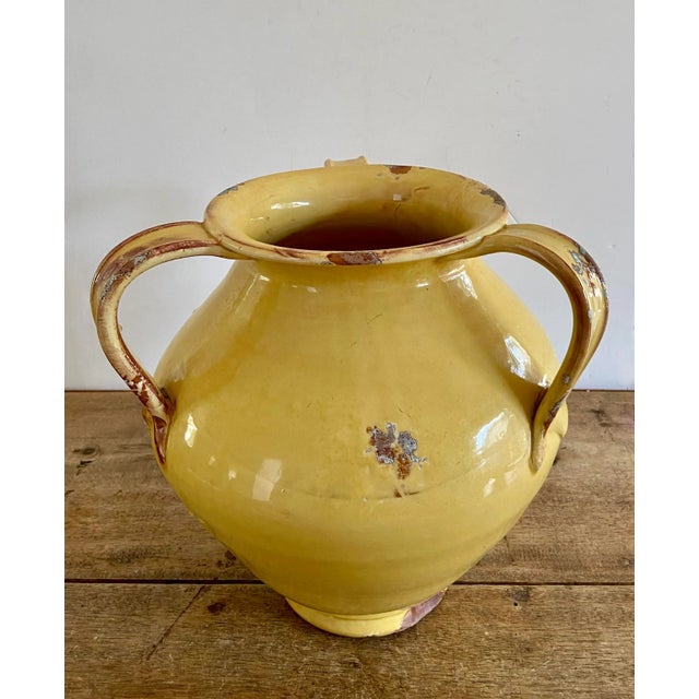 Stunning vintage Fortunata vase (urn, jug,...) with three handles in a goldenrod glaze with sienna distressing. A heavy,...