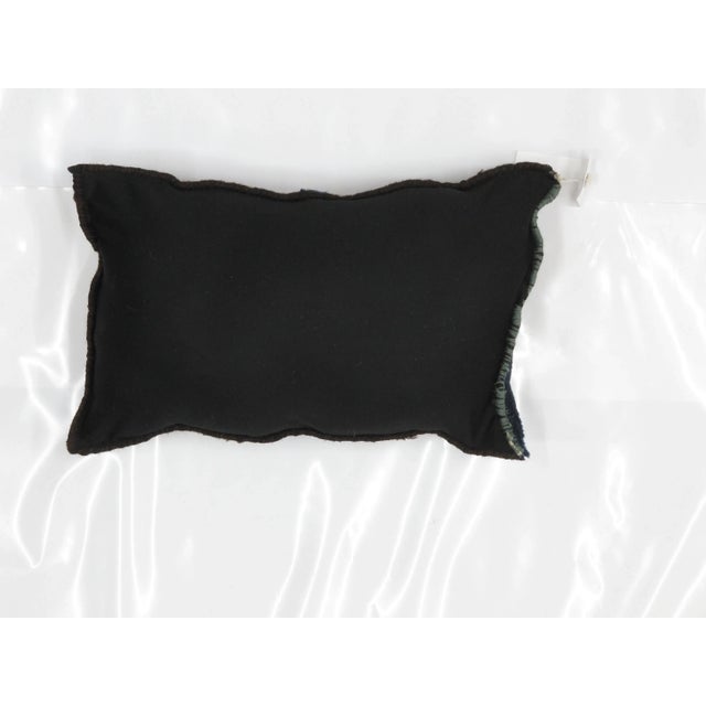 Pillow with genuine hand made antique Chinese Peking rug fragment. Poly fill , fabric backing, sewn closure .