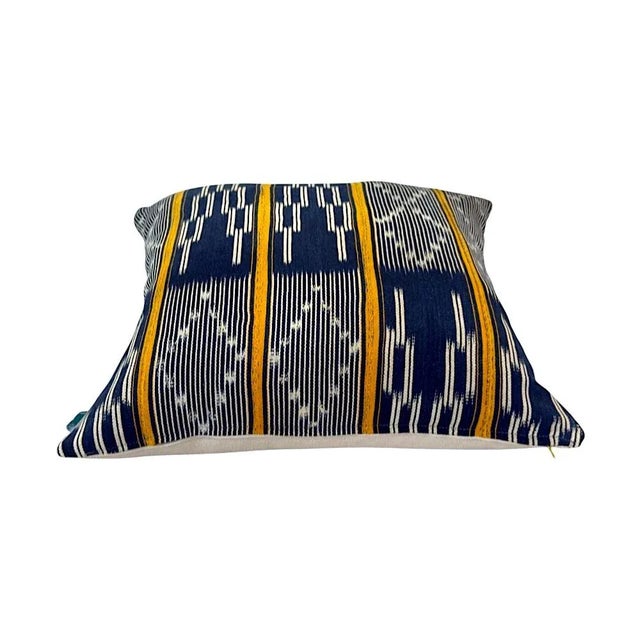 Handcrafted from authentic African mudcloth, this pillow blends bold geometric patterns with earthy tones and subtle pops...