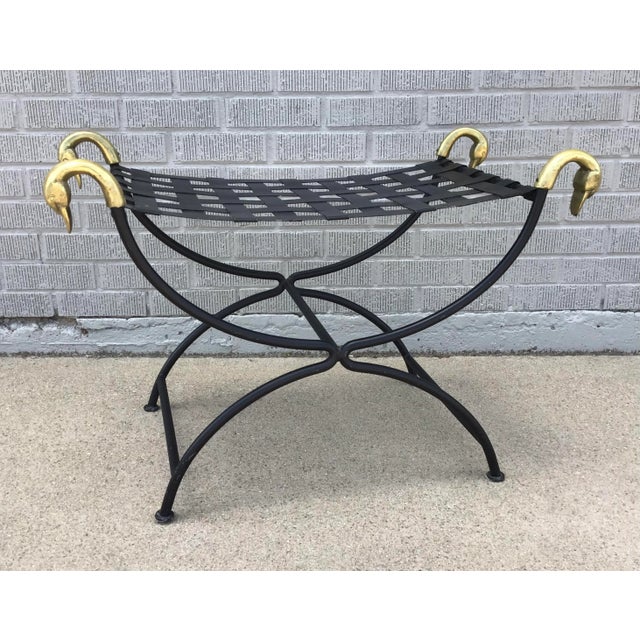 A beautiful French Maison Jansen Attributed Curule stool from the mid 20th century with swan motifs. This exquisite French...