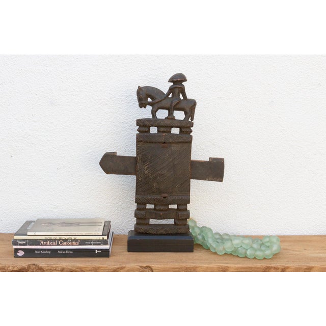 This antique tribal door lock, hand-carved from wood in Mali, Africa, is more than just a functional object; it's a...