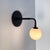 Pair of Small Bent Arm Sconces by Research.Lighting, Black, Glass, Mid Century Modern For Sale In New York - Image 6 of 11