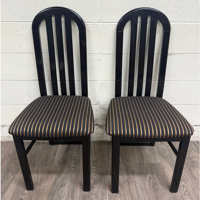 This is a pair of vintage Italian postmodern dining side chairs made by ID Export SRL in 1992. Crafted in Italy, they...