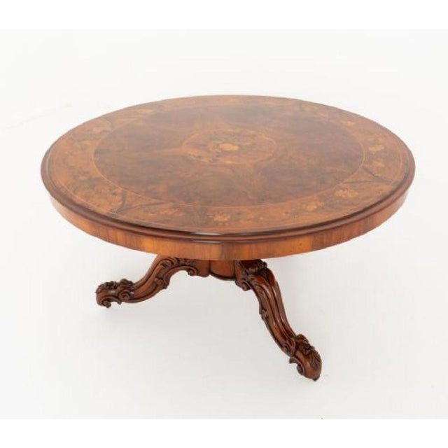 Stunning quality burr walnut Victorian marquetry centre table. List 1860 The table is raised upon a triform base with...