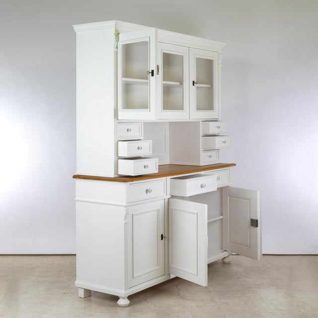 This kitchen buffet combines timeless design with practical functionality. Crafted from solid pine, this three-door buffet...