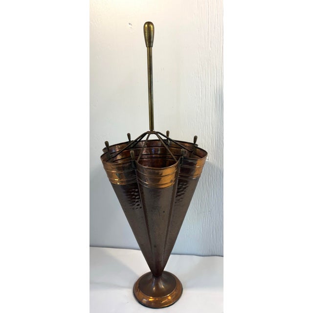 Love this beautiful hammered copper umbrella stand! From Europe