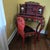 Stunning Japanese red lacquer wood carved writing desk and chair set. The desk has a hutch top with two doors (the door on...