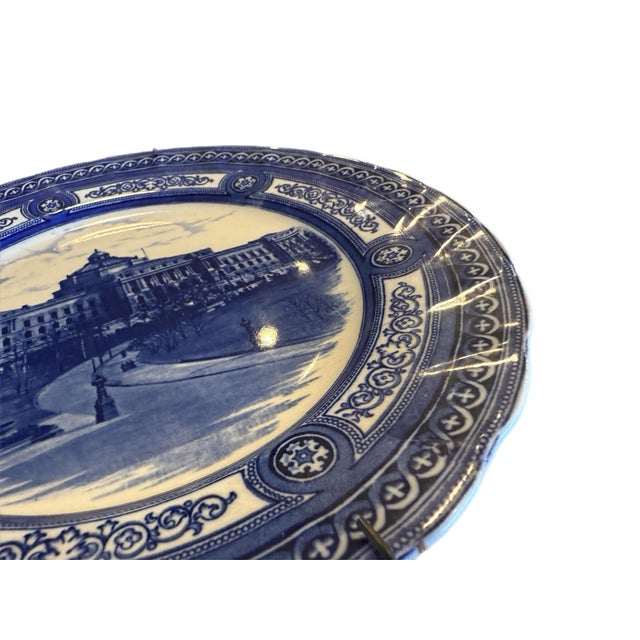 Striking flow blue architectural transferware plate featuring a finely rendered view of one of Washington, D.C.’s grand...