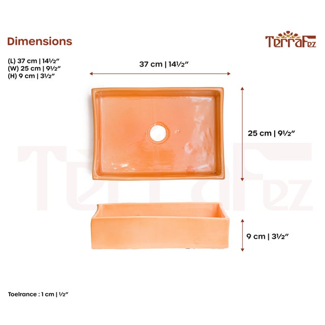 Rectangular ceramic washbasin with orange finish for bathroom vanity. Above-counter installation suits various vanity...