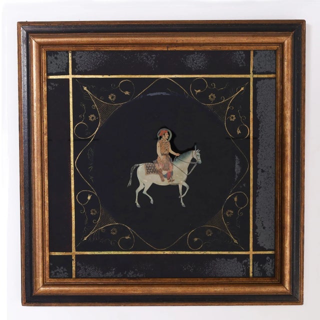 Vintage pair of Anglo Indian watercolors depicting men on horseback decorated with gold leaf floral and geometric designs....