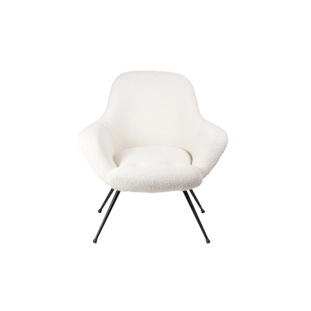 Pair of cocktail armchairs standing on four black lacquered metal. Back, seat and arms covered by our workshops with a...