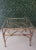 Petite faux bamboo Hollywood Regency side table. 18" x 18" Glass top. Lower rack for books or display. Quality gold tone...