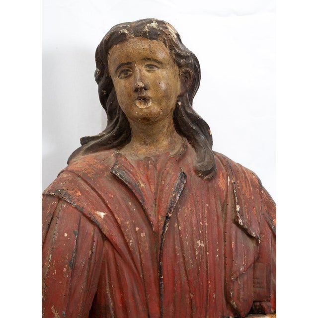 Description: An antique polychrome wooden reliquary bust dating from the late 17th century, of Spanish origin. The face...