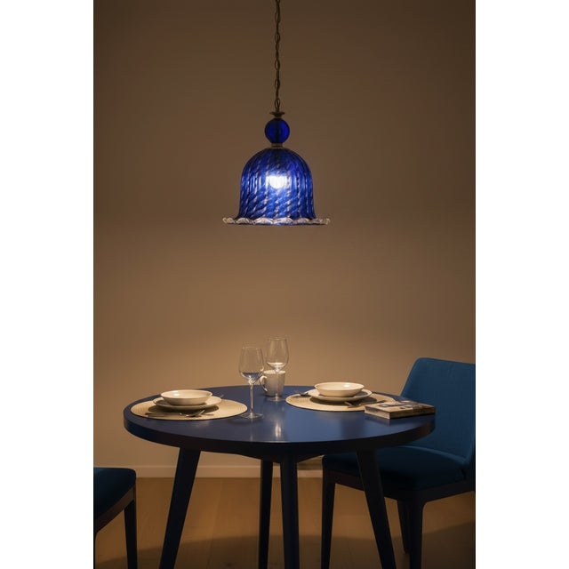 Vintage Murano Blue Glass Pendant Light, Italy, 1980s Striking vintage pendant light crafted in Murano, Italy, dating to...