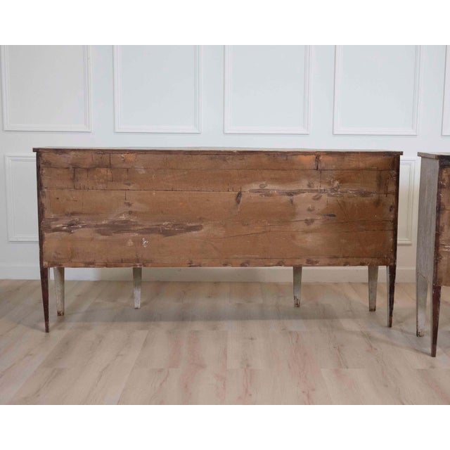 A refined and architecturally balanced Italian mid-19th century neoclassical sideboard, crafted in carved wood and...