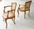 A pair of beautifully crafted chairs by Marie Albert. Hand carved detail and dowel construction, the cane is done in the...