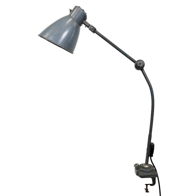 Large industrial table lamp with three adjustable joints made in former Czechoslovalia during the 1960s.It features a grey...