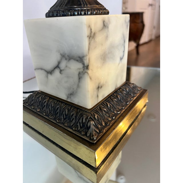 Beautiful cream colored marble lamp with metal accents and brass metal base. A bit heavy but looks great on any living room.