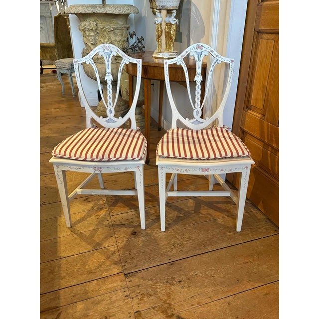 Set of THIRTY Custom Neoclassical Hepplewhite Georgian Dining Chairs. Hand painted in off white with flower details on...