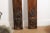 A pair of French vertical carved wooden panels from the late 19th century, with ribbon-tied floral bouquets and urns....