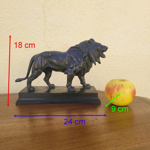 Bronze lion with a brown patina, after the famous Walking Lion by Antoine-Louis Barye. This sculpture is signed "ALF....