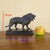 Bronze lion with a brown patina, after the famous Walking Lion by Antoine-Louis Barye. This sculpture is signed "ALF....