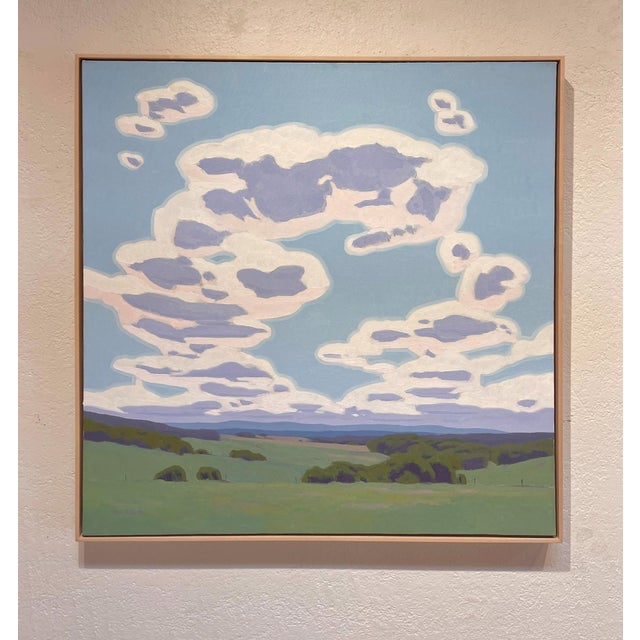 Endless Return captures a serene landscape dominated by expansive skies filled with soft, billowing clouds that evoke a...