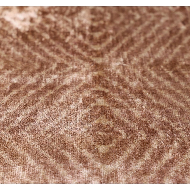 "Add a layer of luminous, tonal texture to your space with this masterfully hand-knotted silk velvet ikat pillow....