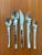 59 piece place setting of retired modernist Profile pattern stainless flatware. Excellent gently used cared for condition....