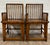 This is a stunning pair of antique Chinese “double happiness” dining arm chairs, believed to be made of walnut, and...