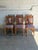 This set of 6 dining chairs showcases turned wooden legs and tall slatted backrests. Vintage 1980s. Crafted from solid...