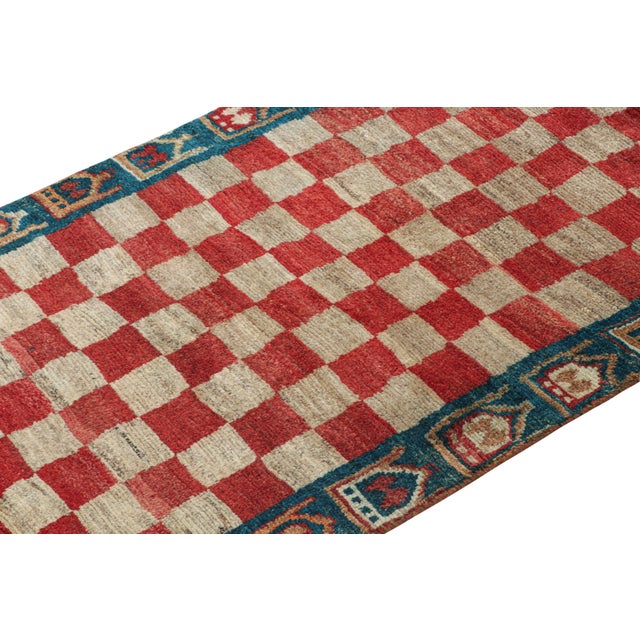 This vintage 3x6 Persian runner is a Gabbeh rug that originates from the Qashqai tribe—hand-knotted in wool circa...