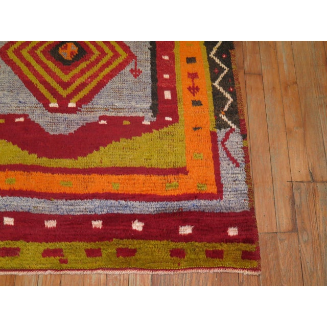 Dazzling and Auspicious best describe this Turkish rug with fuzzy angora wool. Measures: 3'6'' x 5'9''.